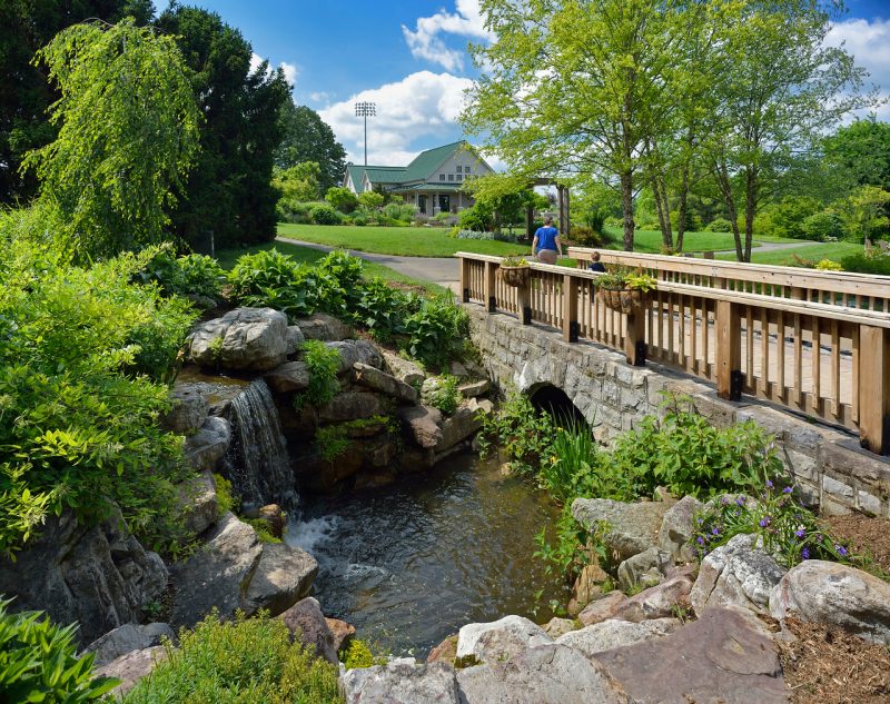A view of the small waterfall located next to the bridge at the Peggy Lee Hahn Gardens and Pavilion.