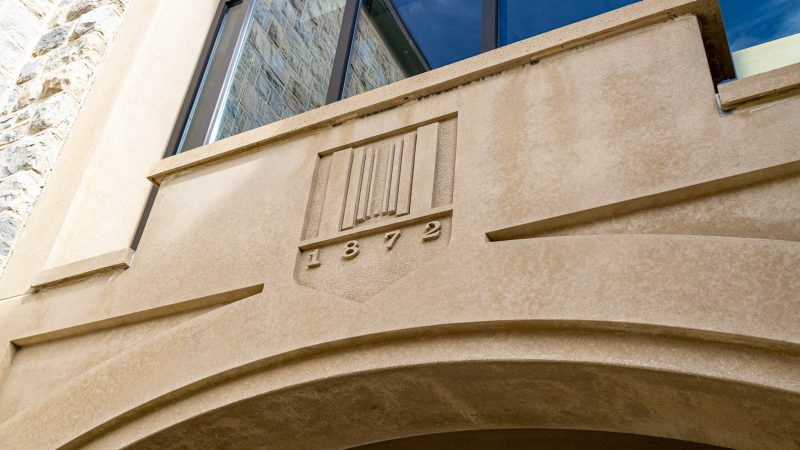 The classic 1872 logo etched into the side of Peddrew-Yates Hall. Photo by Luke Williams for Virginia Tech.